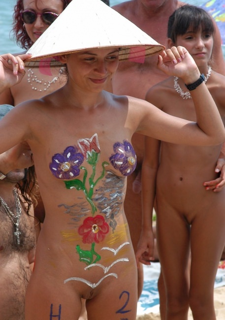 Mothers and daughters nudists on a beach - video of a family nudism