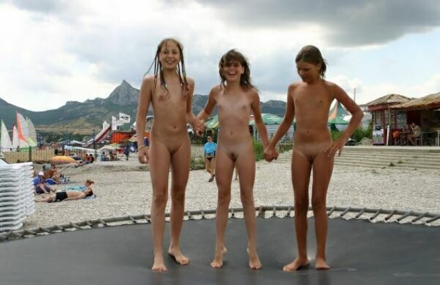Girls nudists on a beach spring bare on a trampoline